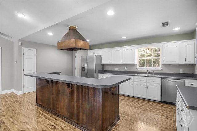 324 Elm St, Eden, GA 31307 - kitchen featuring stainless steel appliances, dark countertops, light wood-style flooring, and recessed lighting