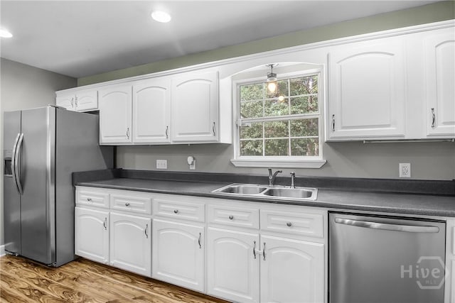 324 Elm St, Eden, GA 31307 - kitchen featuring appliances with stainless steel finishes, dark countertops, white cabinets, wood finished floors, and recessed lighting