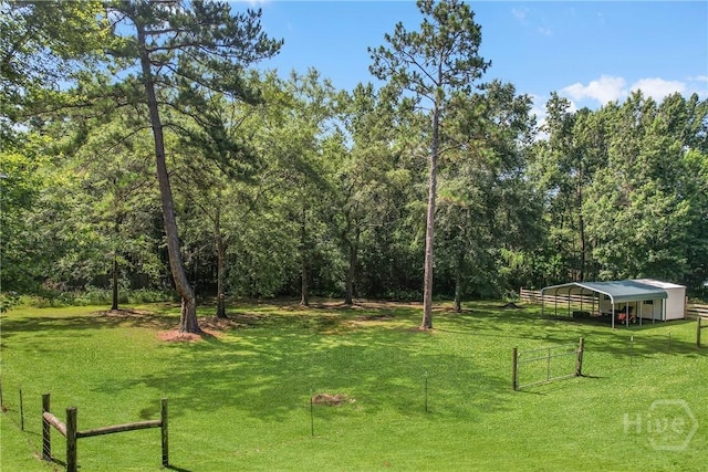 324 Elm St, Eden, GA 31307 - view of yard with a detached carport and a forest view
