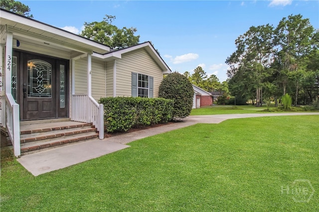 324 Elm St, Eden, GA 31307 - view of exterior entry featuring a yard