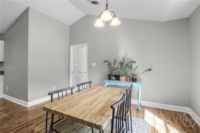 324 Elm St, Eden, GA 31307 - dining room featuring a chandelier, wood finished floors, and vaulted ceiling