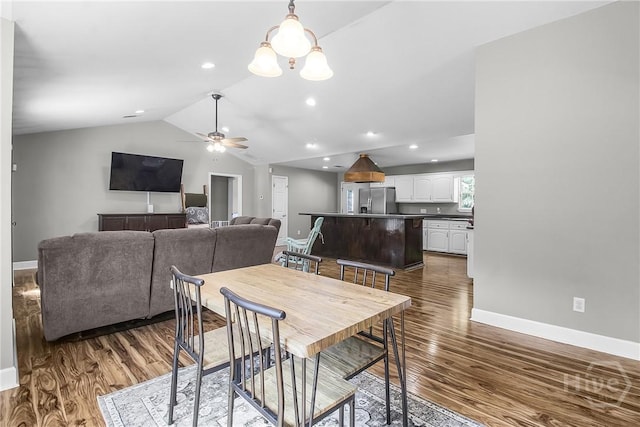 324 Elm St, Eden, GA 31307 - dining room with dark wood finished floors, vaulted ceiling, ceiling fan, a chandelier, and recessed lighting