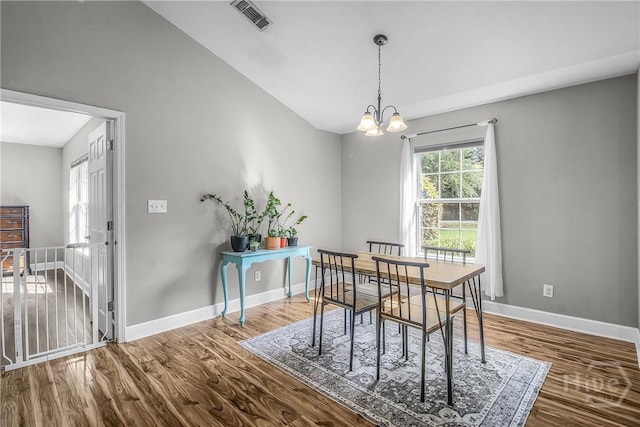 324 Elm St, Eden, GA 31307 - dining room featuring wood finished floors, a chandelier, and lofted ceiling