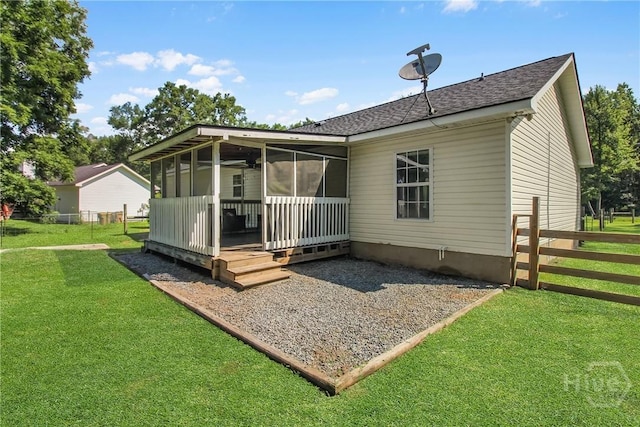 324 Elm St, Eden, GA 31307 - back of property featuring a sunroom and a shingled roof