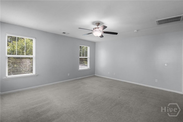 129 Winslow Cir, Savannah, GA 31407 - carpeted empty room with healthy amount of natural light, a ceiling fan, and a smoke detector