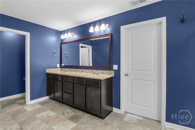 129 Winslow Cir, Savannah, GA 31407 - bathroom featuring double vanity and stone finish floors