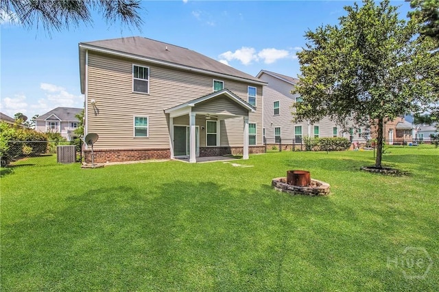 129 Winslow Cir, Savannah, GA 31407 - rear view of house featuring a fire pit and a fenced backyard
