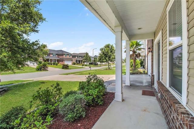129 Winslow Cir, Savannah, GA 31407 - porch with a lawn and a residential view