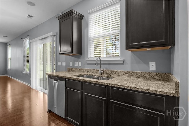 129 Winslow Cir, Savannah, GA 31407 - kitchen featuring stainless steel dishwasher, dark wood-type flooring, and dark cabinetry