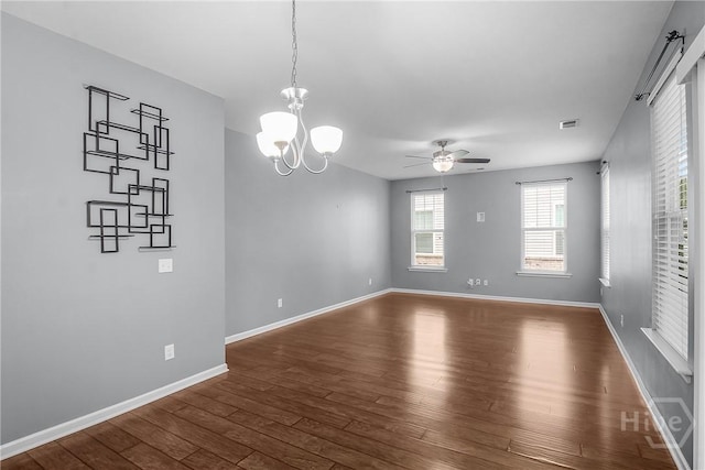 129 Winslow Cir, Savannah, GA 31407 - spare room featuring dark wood-type flooring, a ceiling fan, and a chandelier
