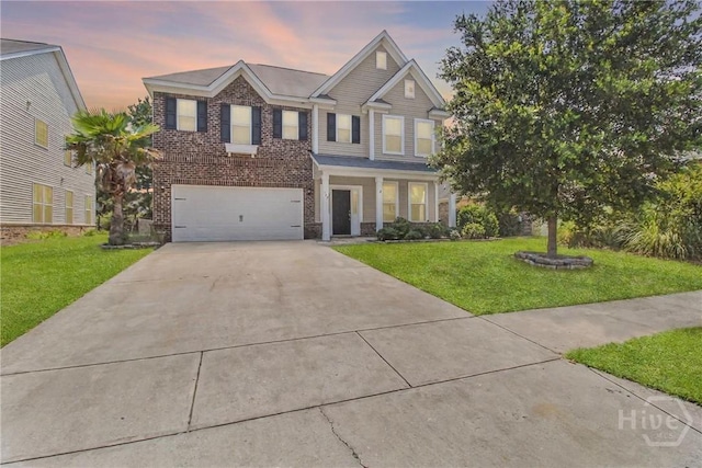 129 Winslow Cir, Savannah, GA 31407 - view of front of property featuring concrete driveway, an attached garage, a lawn, and brick siding