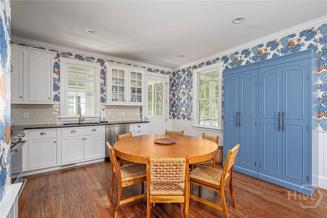 46 Cherry Laurel Ln, Richmond Hill, GA 31324 - dining room featuring dark wood-type flooring, crown molding, and wallpapered walls