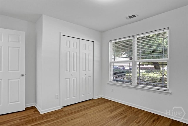 93 Lake Shore Blvd, Port Wentworth, GA 31407 - unfurnished bedroom with wood finished floors and a closet