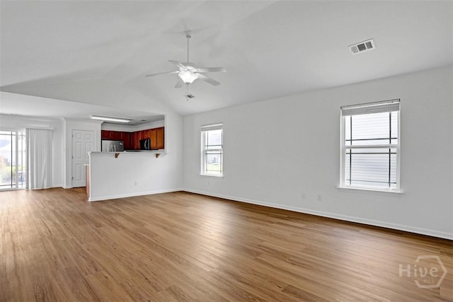 93 Lake Shore Blvd, Port Wentworth, GA 31407 - unfurnished living room with lofted ceiling, wood finished floors, and a ceiling fan