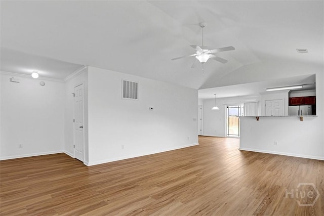 93 Lake Shore Blvd, Port Wentworth, GA 31407 - unfurnished living room featuring a ceiling fan, light wood-style floors, and vaulted ceiling