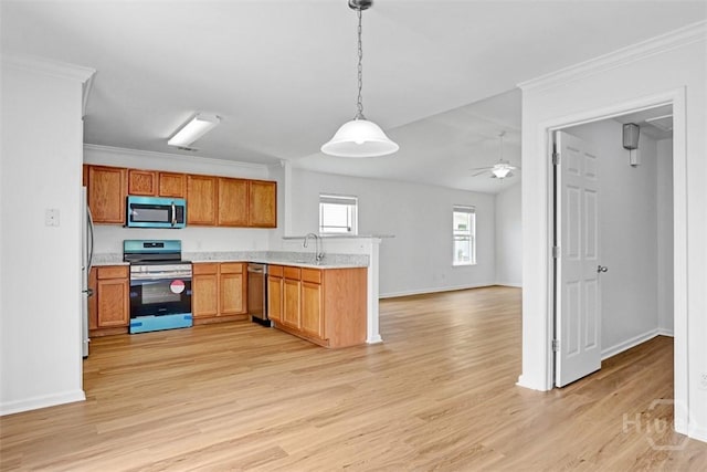 93 Lake Shore Blvd, Port Wentworth, GA 31407 - kitchen with appliances with stainless steel finishes, a peninsula, light wood finished floors, light countertops, and open floor plan
