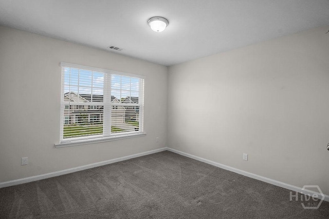 105 Telford St, Savannah, GA 31407 - empty room featuring baseboards and dark colored carpet