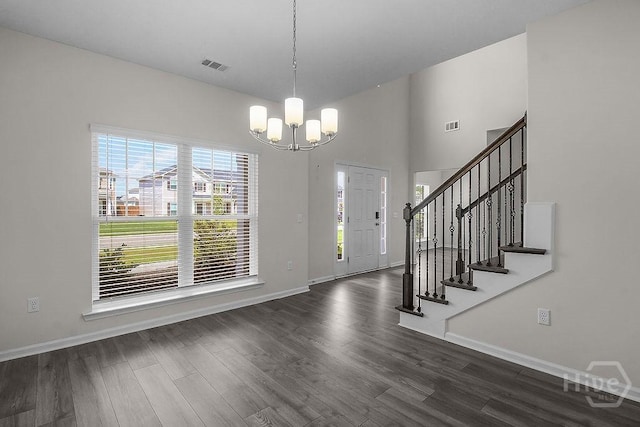 105 Telford St, Savannah, GA 31407 - foyer entrance with a chandelier, dark wood-type flooring, stairway, and a towering ceiling