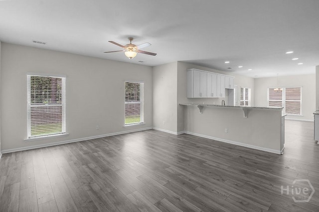105 Telford St, Savannah, GA 31407 - unfurnished living room featuring a ceiling fan, recessed lighting, and dark wood-style flooring