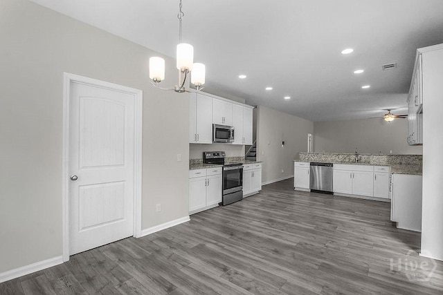 105 Telford St, Savannah, GA 31407 - kitchen with appliances with stainless steel finishes, recessed lighting, a ceiling fan, dark wood finished floors, and white cabinets
