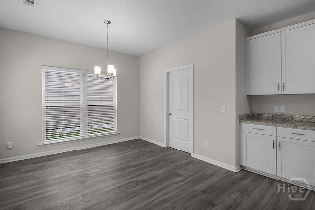 105 Telford St, Savannah, GA 31407 - unfurnished dining area featuring dark wood-style flooring and a chandelier