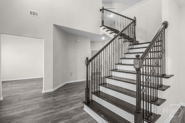 105 Telford St, Savannah, GA 31407 - stairway featuring wood finished floors and a towering ceiling