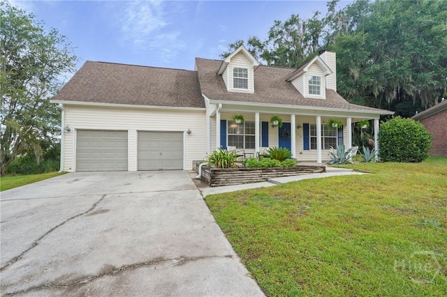 139 Marsh Edge Ln, Savannah, GA 31419 - cape cod house featuring a chimney, covered porch, an attached garage, a front lawn, and driveway