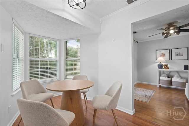 139 Marsh Edge Ln, Savannah, GA 31419 - dining area featuring a textured ceiling, wood finished floors, crown molding, and a ceiling fan