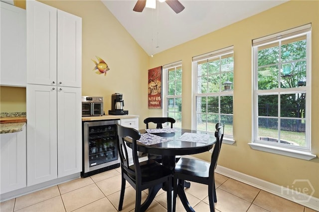 27 Heron View Ct, Richmond Hill, GA 31324 - dining room with wine cooler, healthy amount of natural light, lofted ceiling, light tile patterned flooring, and a ceiling fan