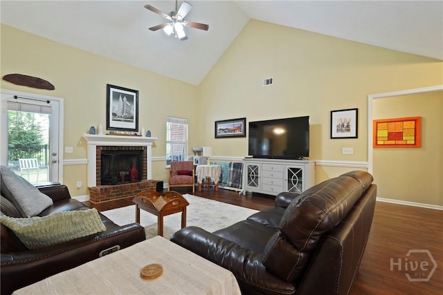 27 Heron View Ct, Richmond Hill, GA 31324 - living area featuring ceiling fan, wood finished floors, high vaulted ceiling, and a brick fireplace