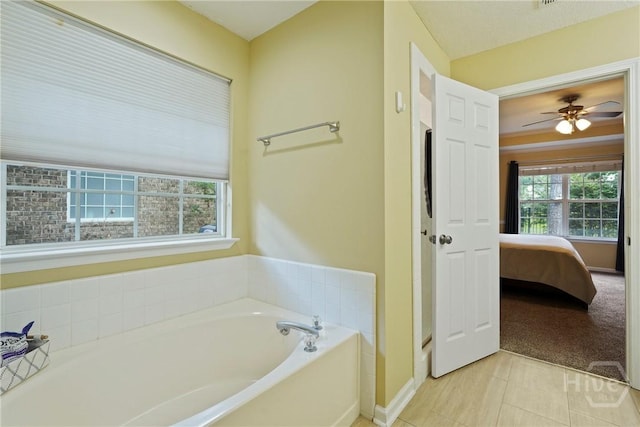 27 Heron View Ct, Richmond Hill, GA 31324 - ensuite bathroom with a garden tub, tile patterned flooring, and ceiling fan