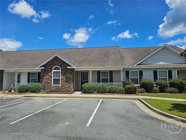 401 Barry Mccaffrey Blvd Unit E2, Hinesville, GA 31313 - ranch-style house with a porch, uncovered parking, and stone siding