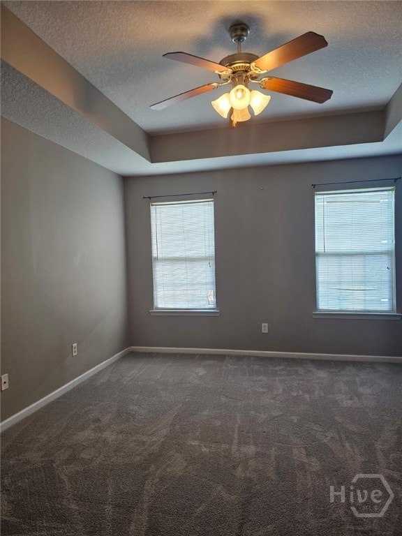 401 Barry Mccaffrey Blvd Unit E2, Hinesville, GA 31313 - unfurnished room featuring a textured ceiling, plenty of natural light, dark carpet, and ceiling fan