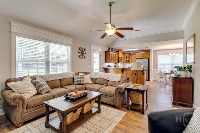 160 Wild Honey Ct, Richmond Hill, GA 31324 - living area featuring a chandelier, light wood-type flooring, plenty of natural light, ceiling fan, and ornamental molding