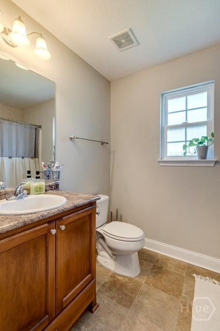 160 Wild Honey Ct, Richmond Hill, GA 31324 - bathroom featuring vanity and a shower with shower curtain
