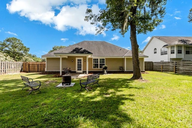 160 Wild Honey Ct, Richmond Hill, GA 31324 - rear view of house featuring an outdoor fire pit, a fenced backyard, a patio, and a shingled roof