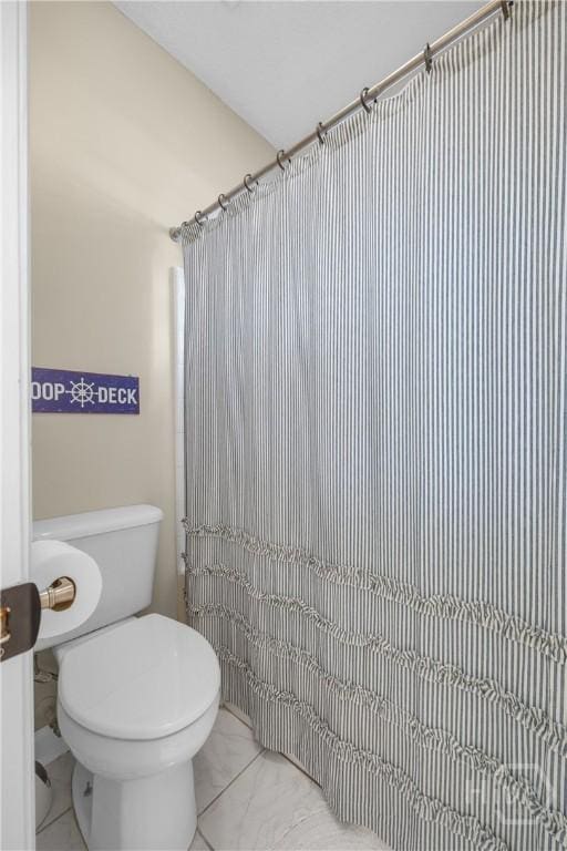 139 Mingarry Dr, Richmond Hill, GA 31324 - full bath featuring marble look tiles and curtained shower