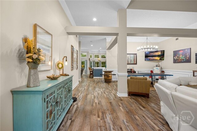 139 Mingarry Dr, Richmond Hill, GA 31324 - living room featuring a chandelier, wood finished floors, wainscoting, and recessed lighting