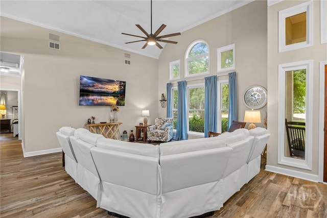 139 Mingarry Dr, Richmond Hill, GA 31324 - living area featuring crown molding, wood finished floors, a ceiling fan, and high vaulted ceiling