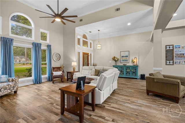 139 Mingarry Dr, Richmond Hill, GA 31324 - living area with a high ceiling, a ceiling fan, wood finished floors, ornamental molding, and recessed lighting