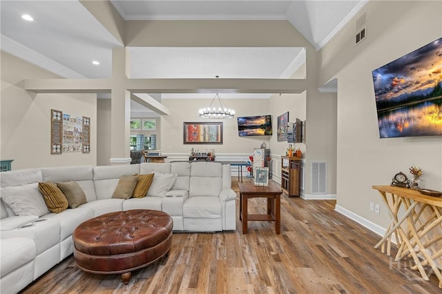 139 Mingarry Dr, Richmond Hill, GA 31324 - living room featuring a chandelier, wood finished floors, recessed lighting, and crown molding