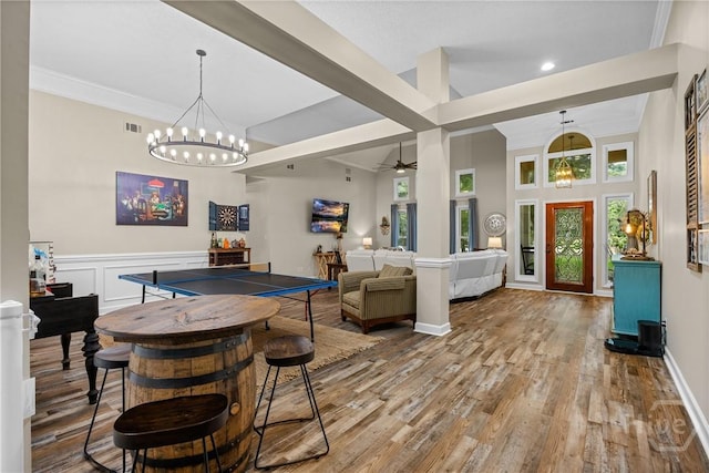 139 Mingarry Dr, Richmond Hill, GA 31324 - bar area with wood finished floors, a chandelier, a ceiling fan, hanging light fixtures, and recessed lighting