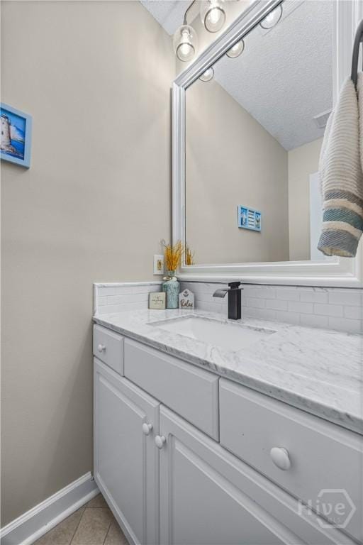139 Mingarry Dr, Richmond Hill, GA 31324 - bathroom featuring vanity, a textured ceiling, and tile patterned floors