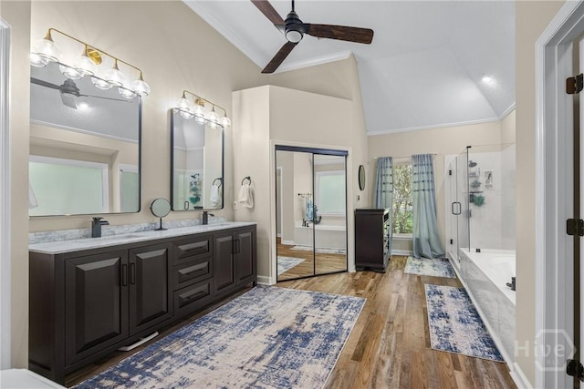 139 Mingarry Dr, Richmond Hill, GA 31324 - bathroom with a ceiling fan, double vanity, ornamental molding, a stall shower, and a garden tub