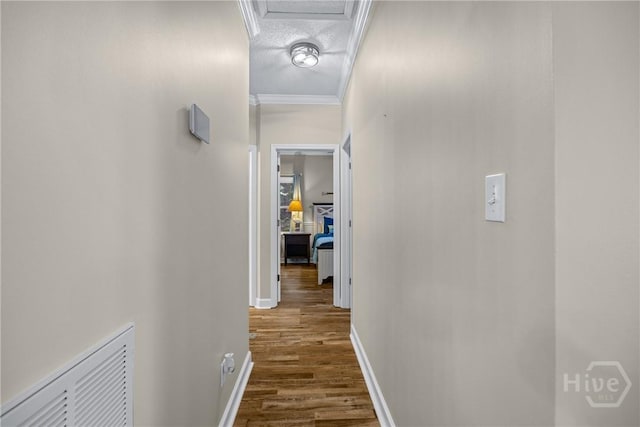 139 Mingarry Dr, Richmond Hill, GA 31324 - corridor featuring dark wood-type flooring, attic access, and crown molding