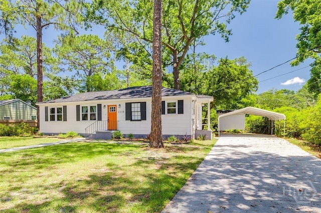 2338 Lorraine Dr, Savannah, GA 31404 - ranch-style home with asphalt driveway, a carport, and a front lawn