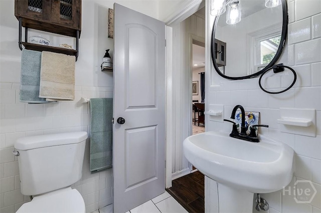 2338 Lorraine Dr, Savannah, GA 31404 - bathroom featuring tile walls and toilet