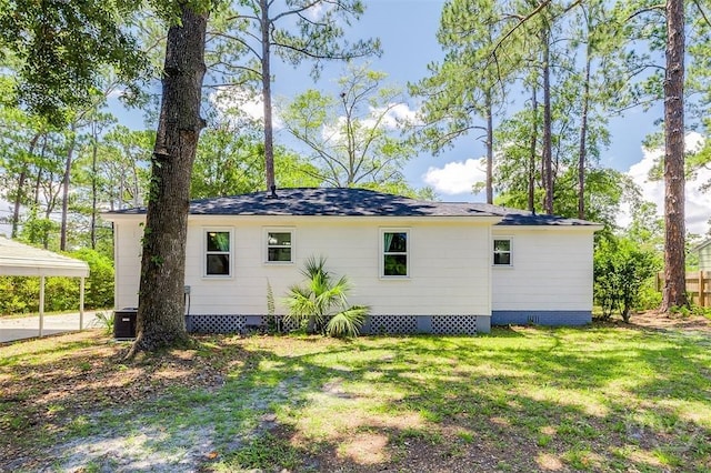 2338 Lorraine Dr, Savannah, GA 31404 - view of home's exterior featuring a lawn, crawl space, and a carport