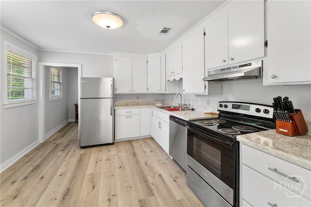 129 Vandiver Rd, Walthourville, GA 31301 - kitchen featuring stainless steel appliances, under cabinet range hood, light wood-type flooring, white cabinetry, and light stone countertops