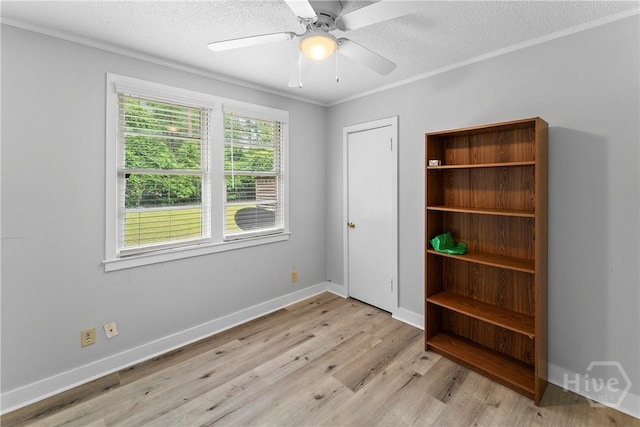 129 Vandiver Rd, Walthourville, GA 31301 - unfurnished bedroom with light wood-style floors, a textured ceiling, ornamental molding, and a ceiling fan